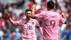 Lionel Messi celebrates a goal with Luis Suarez.