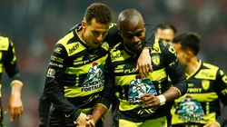 Enner Valencia of Pachuca (R) celebrates after scoring his team's first goal with teammate Oussama Idrissi