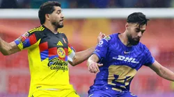 Henry Martin of America competes for the ball against Ruben Duarte of Pumas