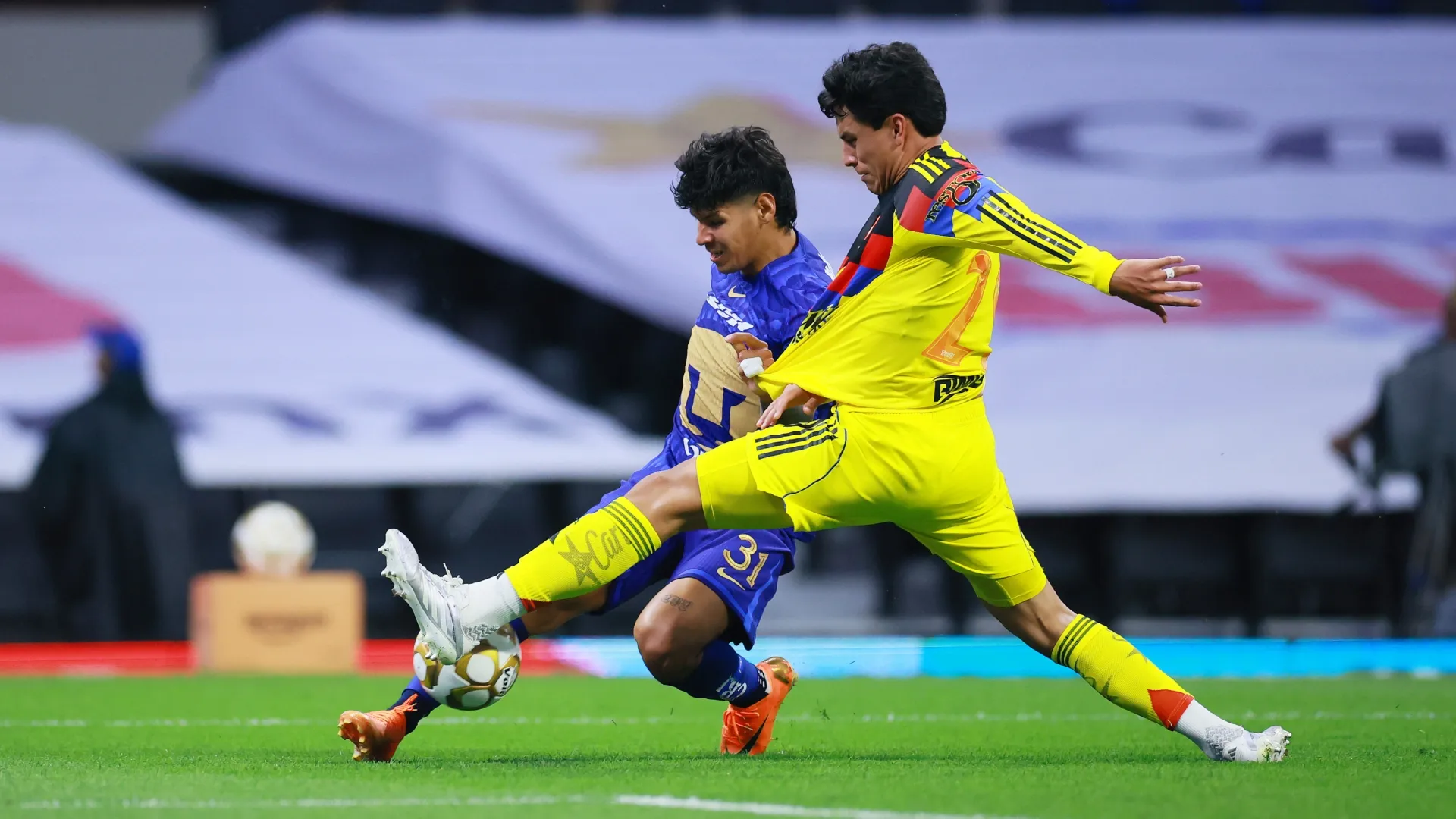 Robert Morales of Pumas competes for the ball against Ramon Juarez of America – Manuel Velasquez/Getty Images