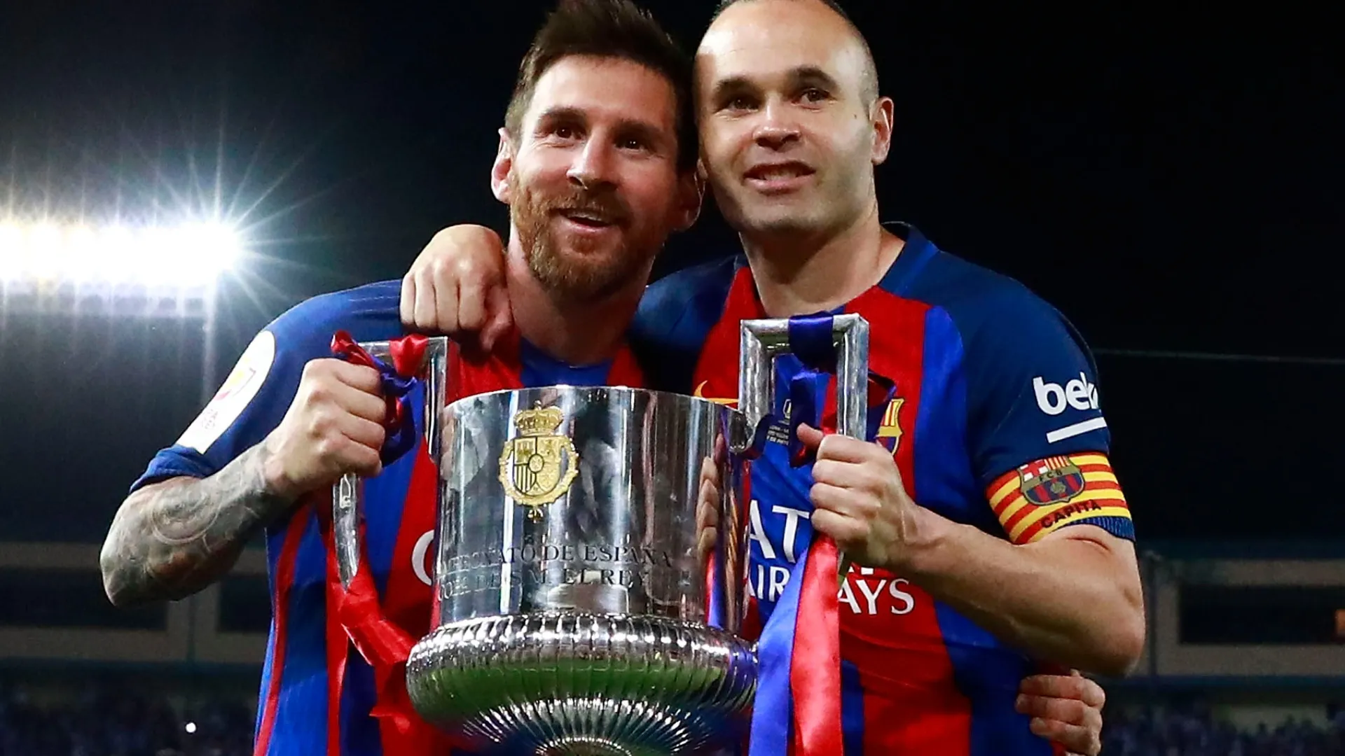 Lionel Messi with Andres Iniesta