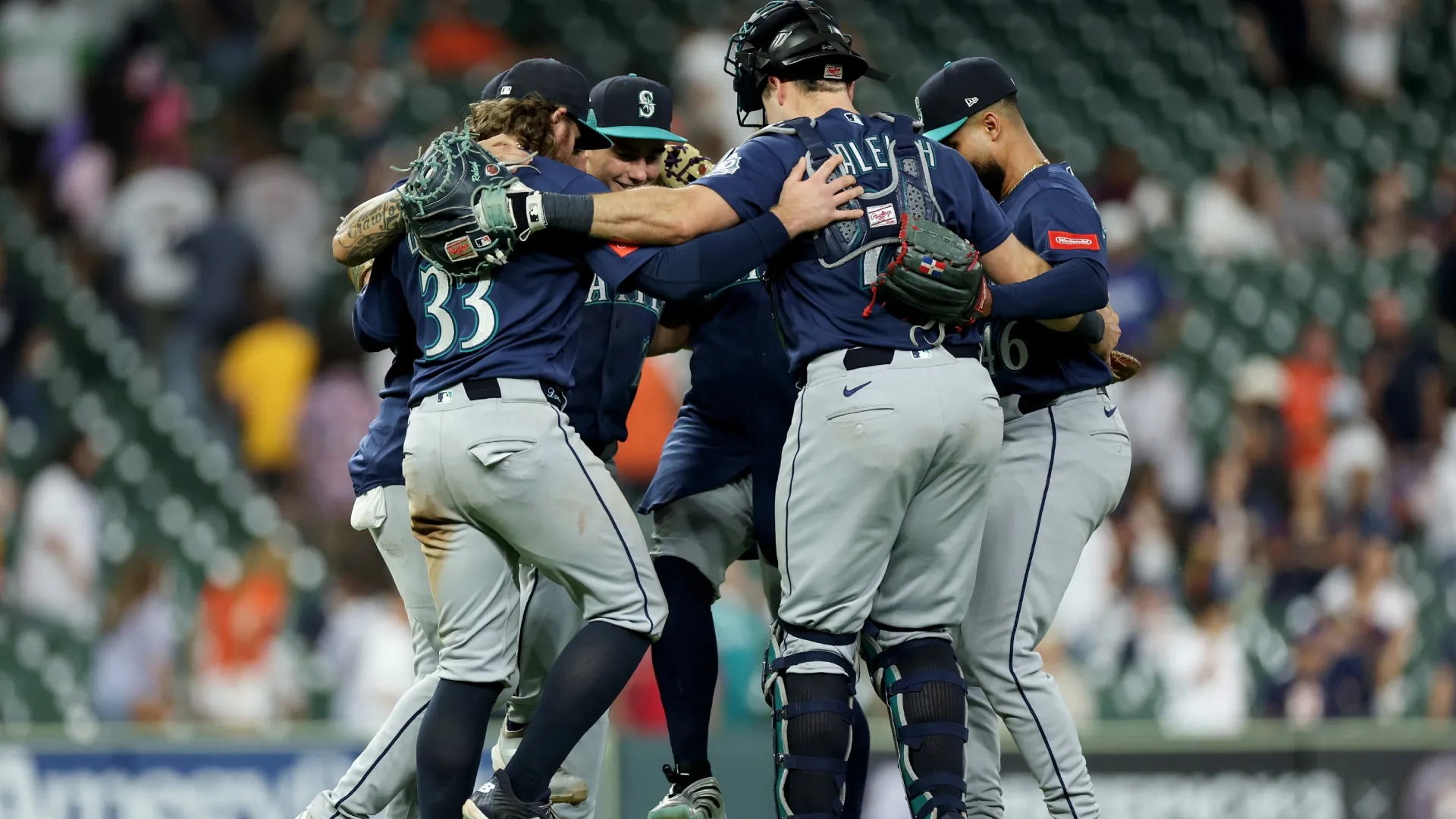 The Mariners celebrate in the infield after defeating the Astros. Tim Warner/Getty Images
