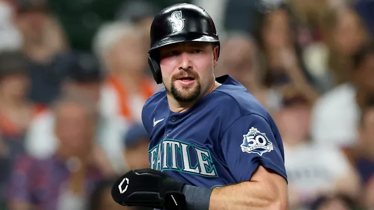 Cal Raleigh #29 of the Mariners scores in the seventh inning.