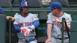 Francisco Lindor #12 of the New York Mets talks with manager Carlos Mendoza #64.