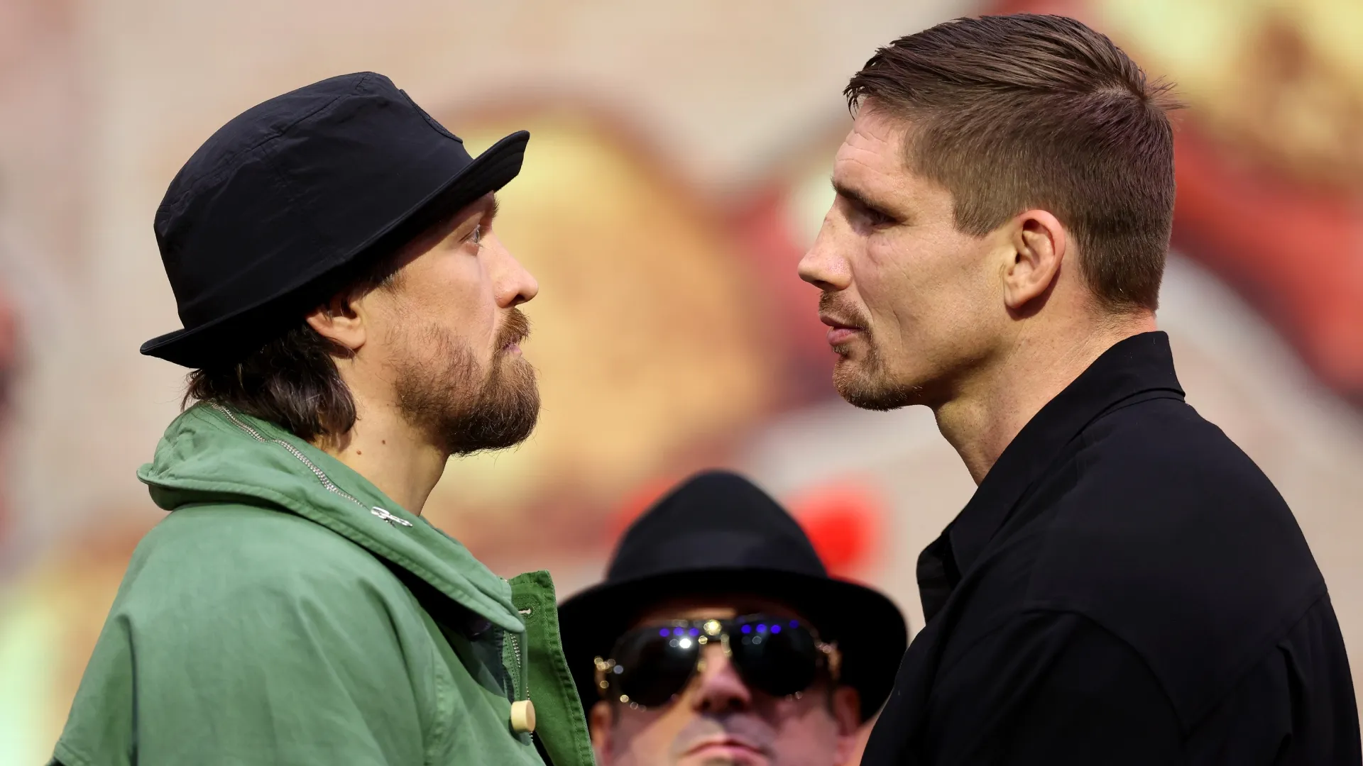 Oleksandr Usyk and Rico Verhoeven face off ahead of their Heavyweight fight. Richard Pelham/Getty Images