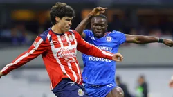 Diego Campillo of Chivas fights for the ball with Osinachi Ebere of Cruz Azul