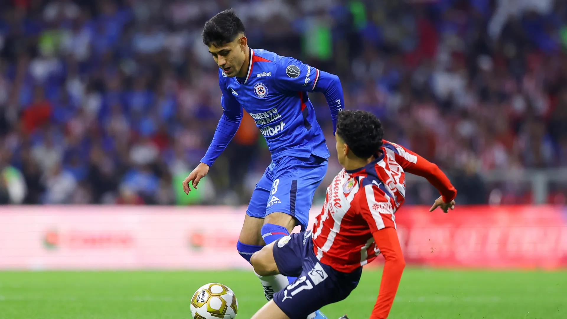 Richard Ledezma of Chivas fights for the ball with Omar Campos of Cruz Azul – Agustin Cuevas/Getty Images