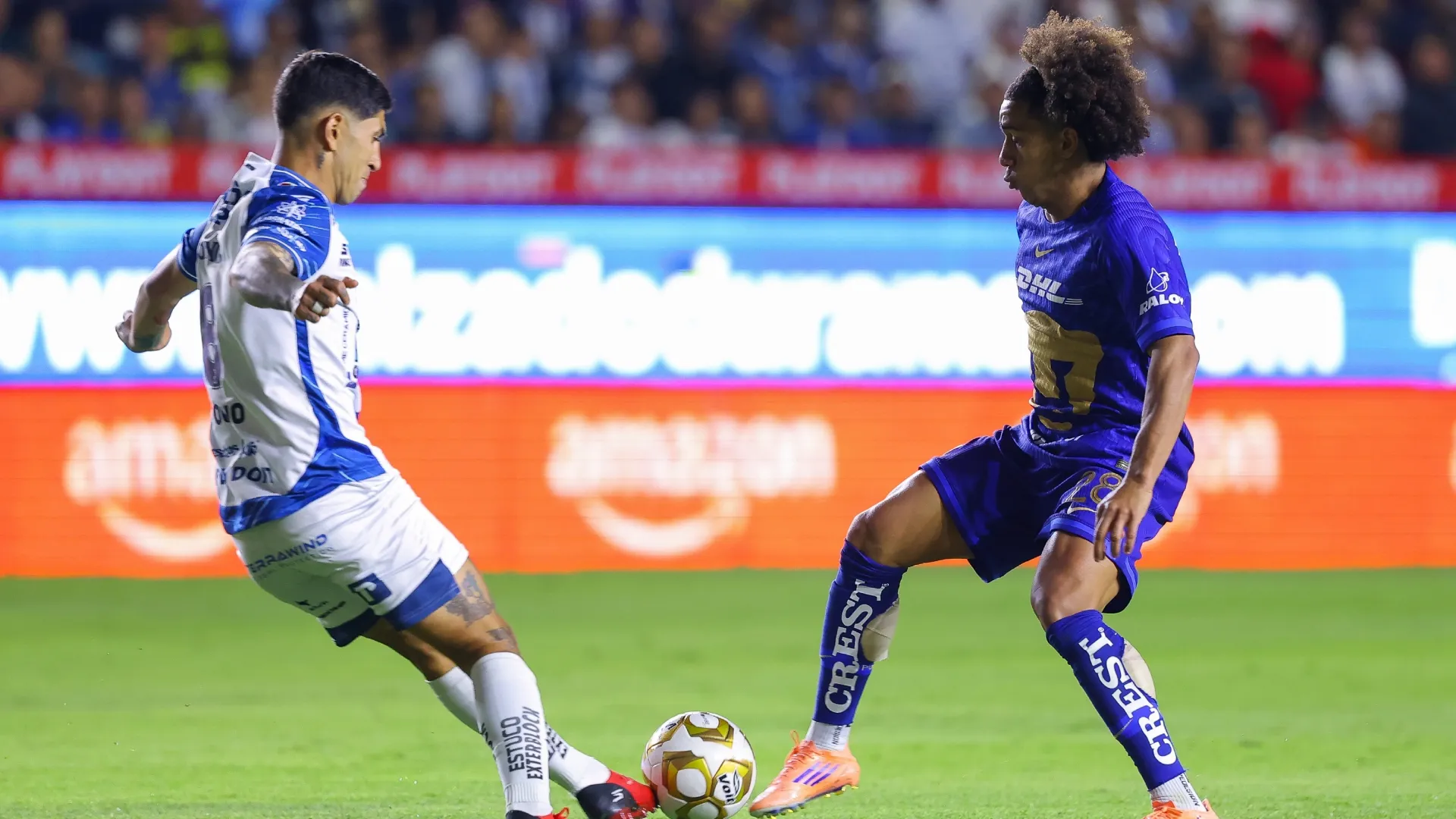 Adalberto Carrasquilla of Pumas fights for the ball with Victor Guzman of Pachuca – Agustin Cuevas/Getty Images