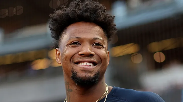 Ronald Acuña Jr. looks on.