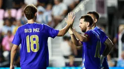 Nico Paz and Lionel Messi of Argentina.