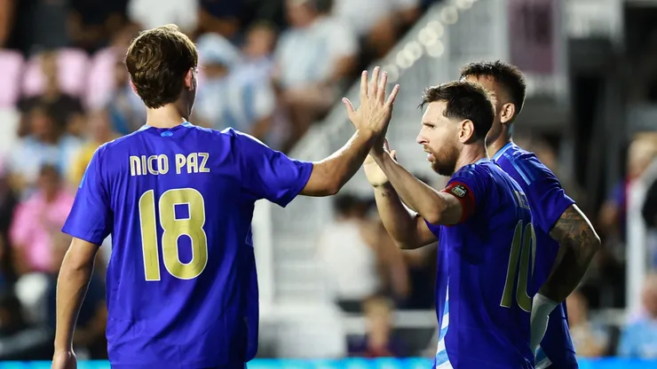 Nico Paz and Lionel Messi of Argentina.