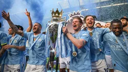 Kyle Walker, Kevin De Bruyne and Jack Grealish lift the Premier League trophy after the Premier League match