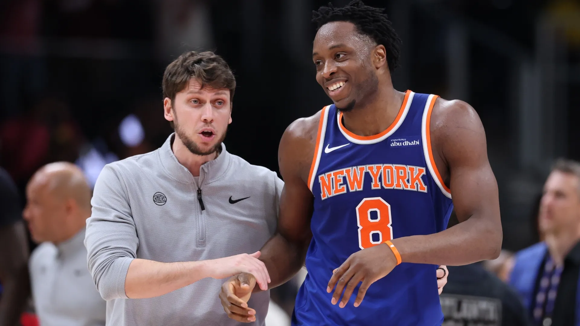 Og Anunoby #8 of the New York Knicks is walked off the court (Source: Kevin C. Cox/Getty Images)