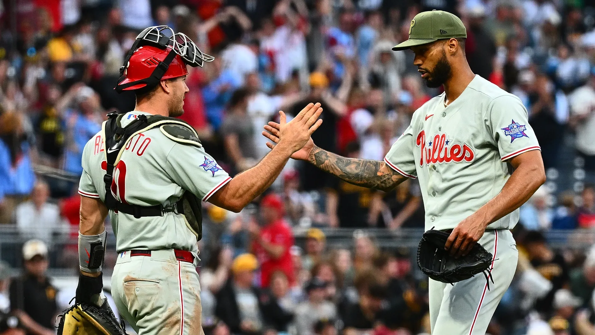 Cristopher Sanchez of the Phillies celebrates with teammate J.T. Realmuto. Justin Berl/Getty Images