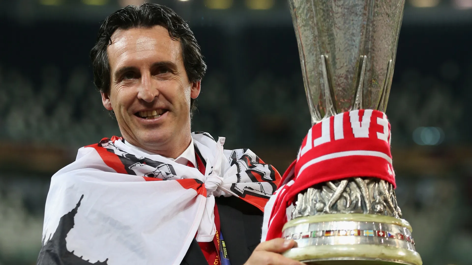 Head Coach Unai Emery of Sevilla celebrates with the Europa league trophy in 2014 (Source: Clive Rose/Getty Images)