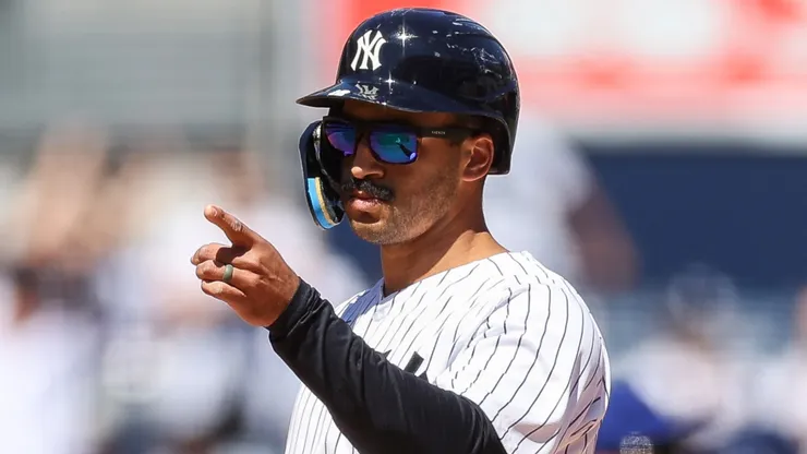 Trent Grisham #12 of the Yankees reacts after hitting a 3-run RBI triple.