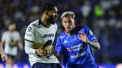 Juninho of Pumas controls the ball against Gonzalo Piovi of Cruz Azul