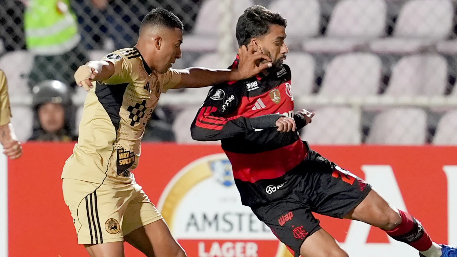 Lucas Paqueta of Flamengo and Osvaldo Valenzuela of Cusco FC – Raul Sifuentes/Getty Images