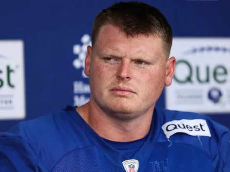 NY Giants C John Michael Schmitz gets challenged by John Harbaugh