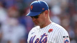 Carlos Mendoza #64 of the Mets walks off the mound after a pitching change.