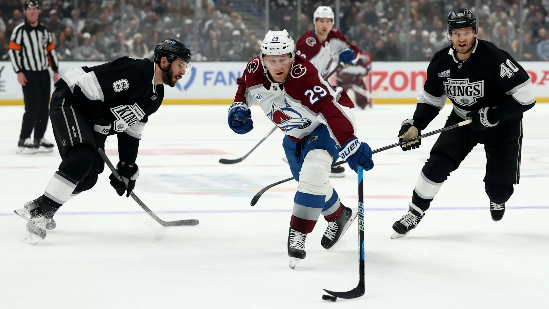Nathan MacKinnon #29 of the Colorado Avalanche splits the defense of the Los Angeles Kings (Source: Harry How/Getty Images)
