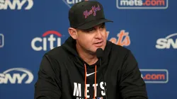 Carlos Mendoza of the Mets answers questions before the game.