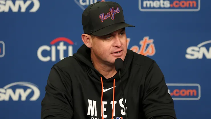 Carlos Mendoza of the Mets answers questions before the game.