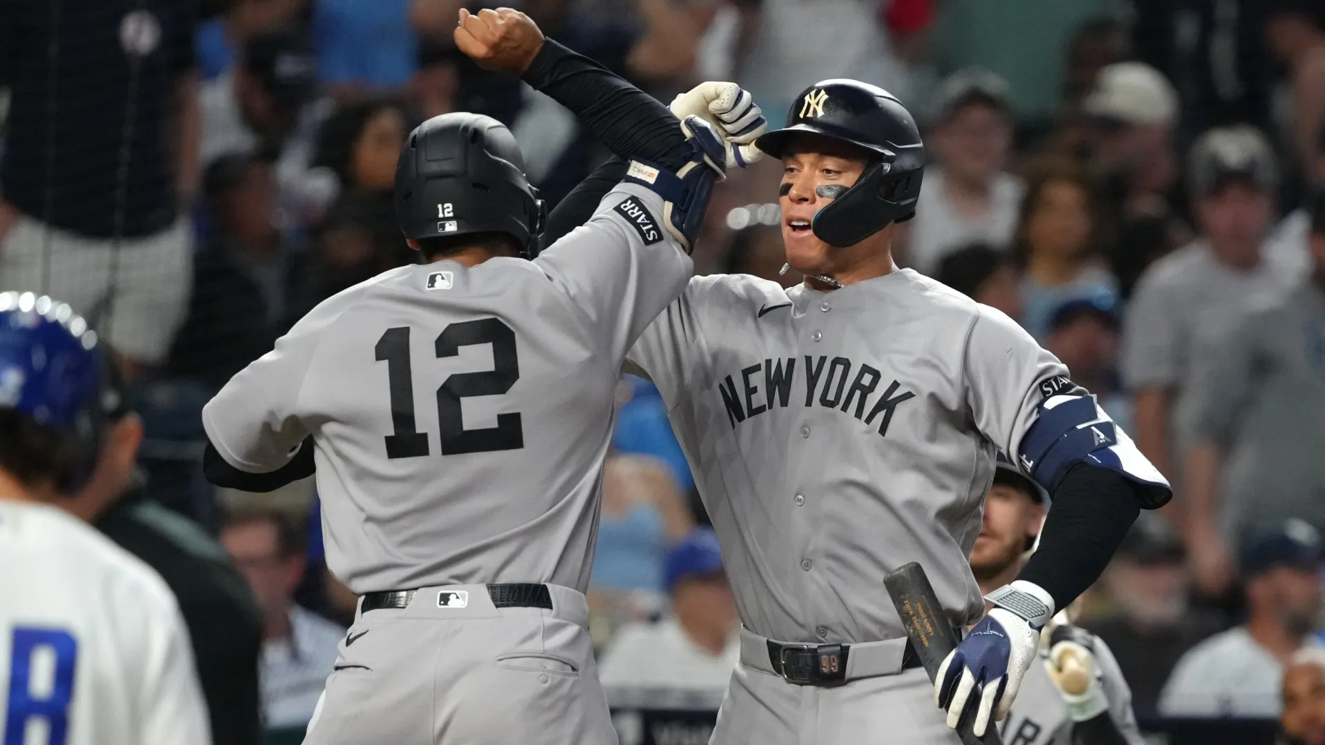Trent Grisham #12 of the Yankees celebrates his home run with Aaron Judge. Ed Zurga/Getty Images