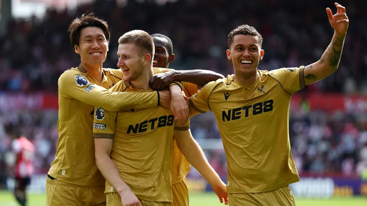 Adam Wharton of Crystal Palace celebrates scoring with teammates during the Premier League match