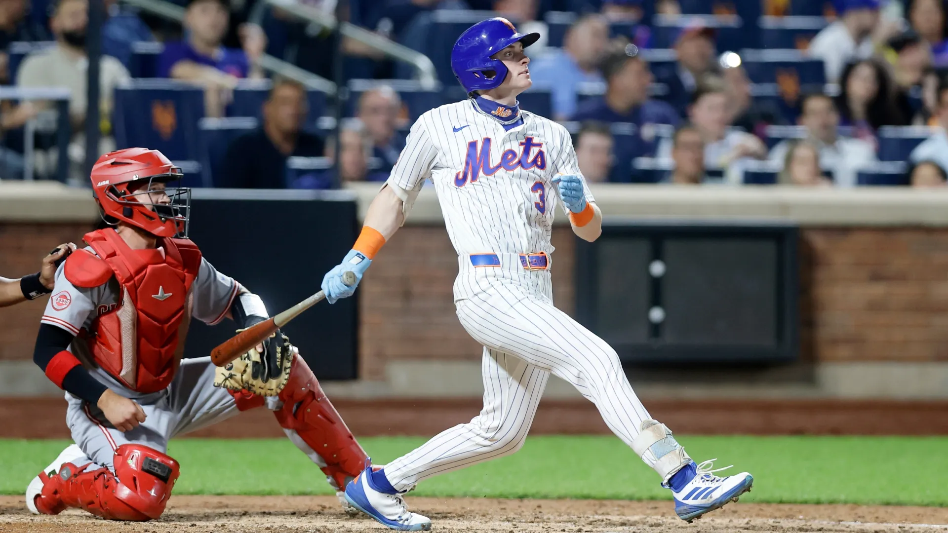 Carson Benge #3 of the Mets follows through on his seventh inning RBI single. Jim McIsaac/Getty Images