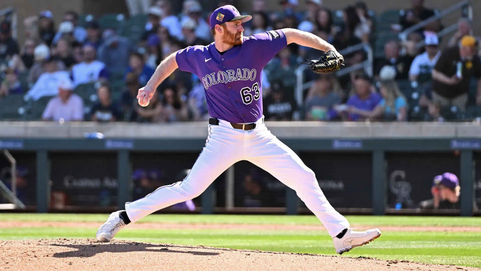 John Brebbia #63 of the Rockies delivers a pitch against the Padres. Norm Hall/Getty Images