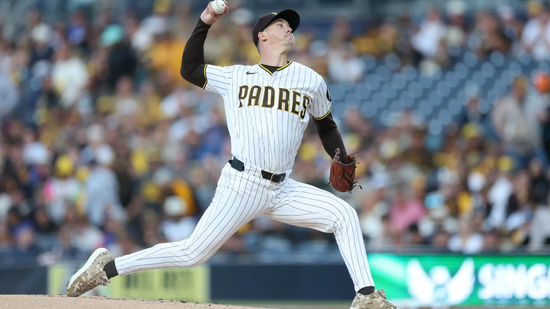 Walker Buehler #10 of the Padres pitches during a game against the Cubs. Sean M. Haffey/Getty Images