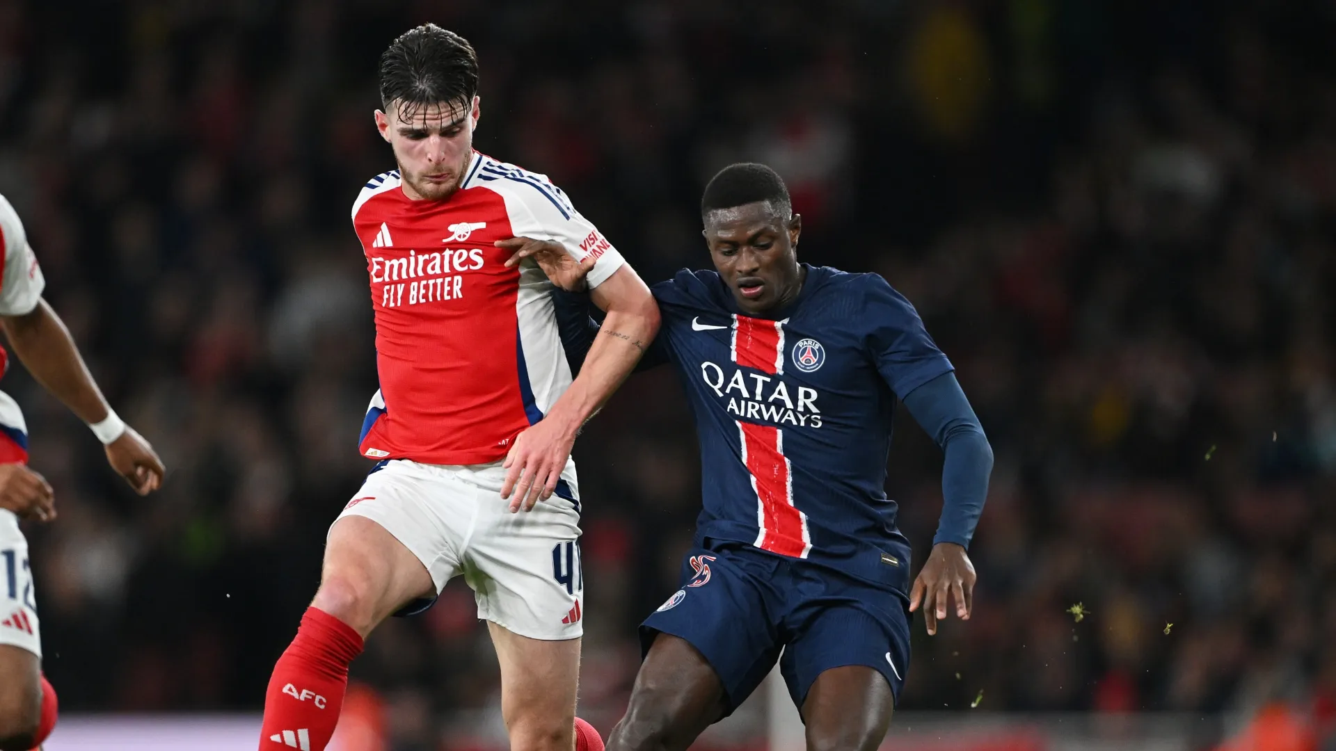 Nuno Mendes of Paris Saint-Germain is challenged by Declan Rice of Arsenal – Shaun Botterill/Getty Images