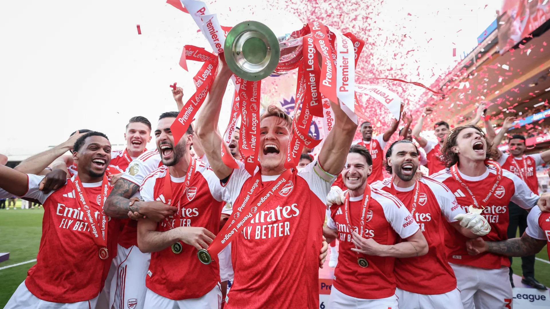 Martin Odegaard of Arsenal lifts the Premier League trophy. Michael Regan/Getty Images