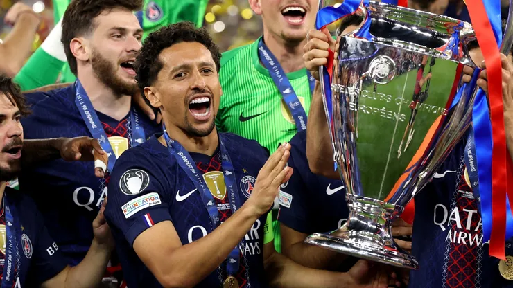Marquinhos of Paris Saint-Germain holds the UEFA Champions League trophy.