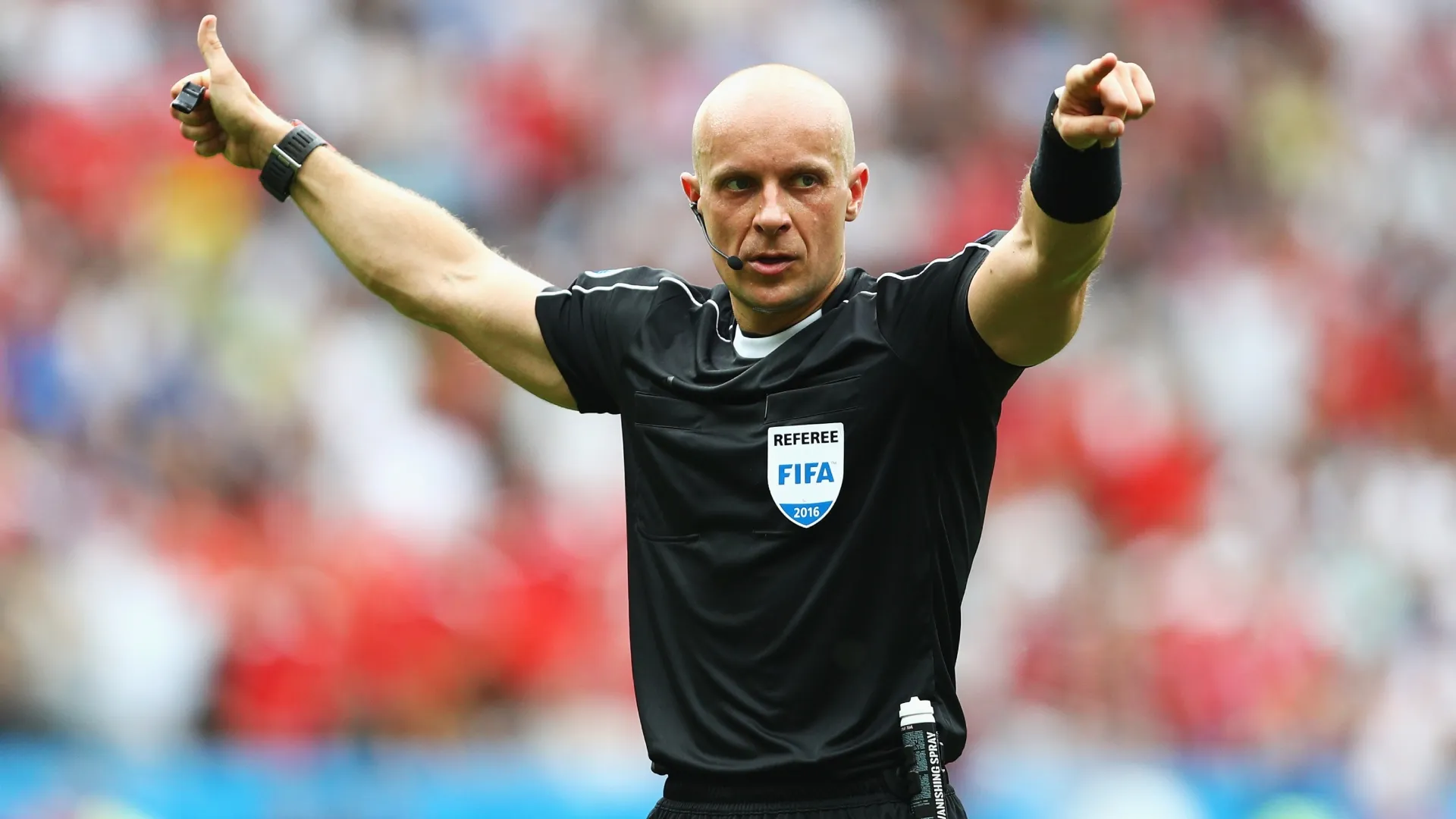 Szymon Marciniak of Poland signals during the UEFA EURO 2016 Group F match (Source: Paul Gilham/Getty Images)
