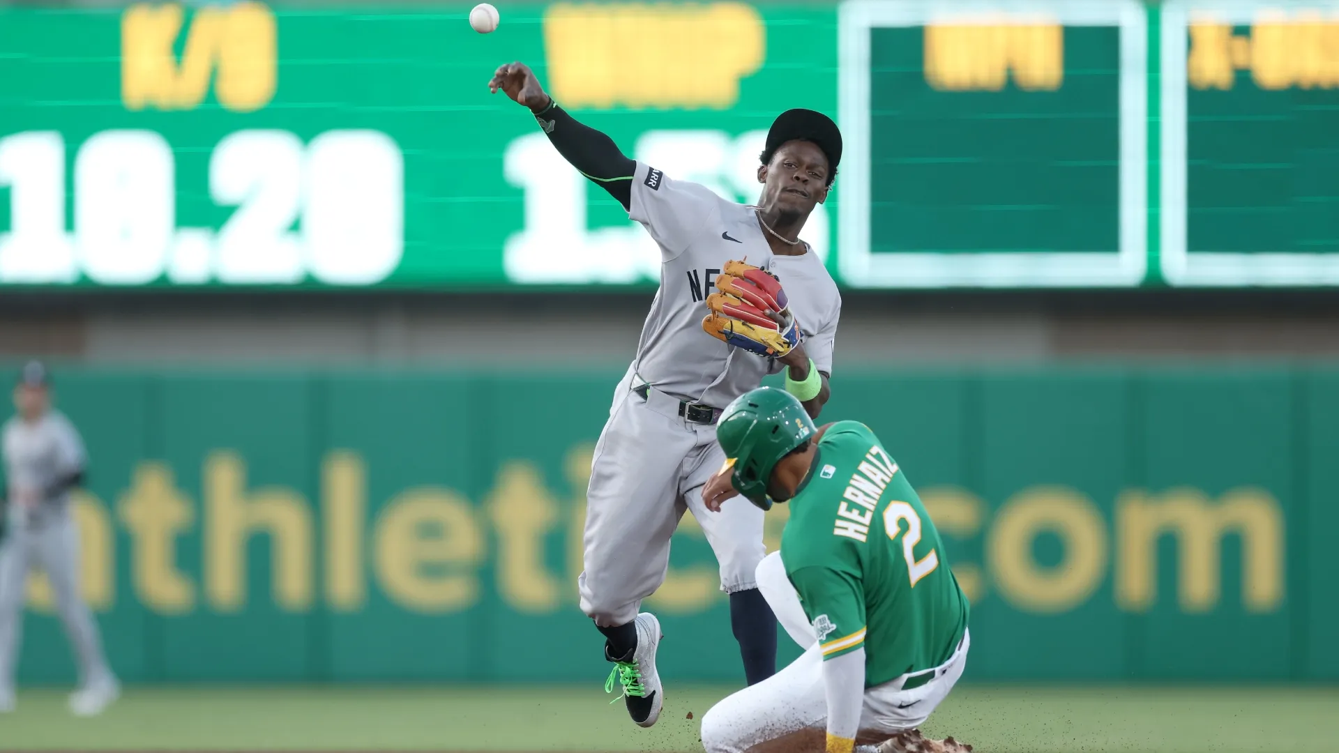 Jazz Chisholm Jr. #13 of the Yankees attempts to turn a double play. Ezra Shaw/Getty Images