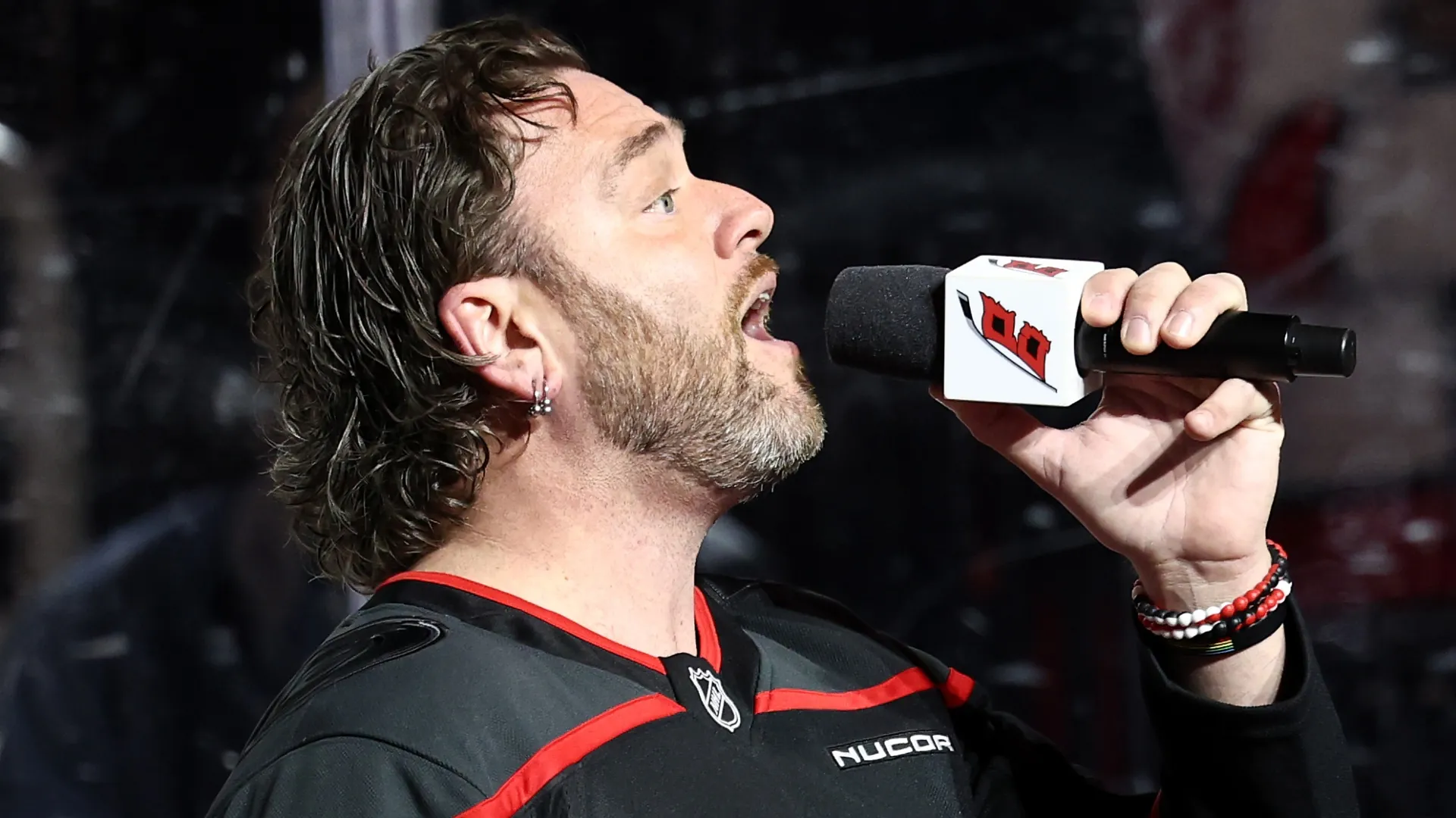 Adam Lee Decker performs the National Anthem prior to the game between the Hurricanes and the Penguins in 2025 (Source: Jared C. Tilton/Getty Images)