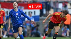 Ivan Perisic of Croatia is challenged by Charles De Ketelaere of Belgium.