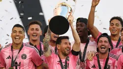Lionel Messi #10 of Inter Miami CF lifts the Champion's trophy.