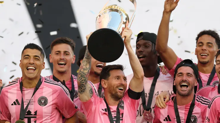 Lionel Messi #10 of Inter Miami CF lifts the Champion's trophy.