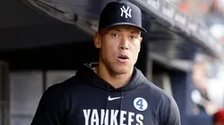 Aaron Judge #99 of the Yankees looks on from the dugout.