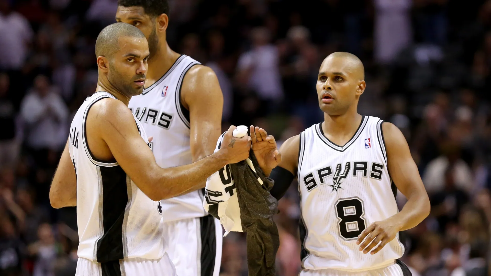 Patty Mills, Tony Parker and Tim Duncan celebrate in Game Two of the Western Conference Finals during the 2014 NBA Playoffs (Source: Ronald Martinez/Getty Images)