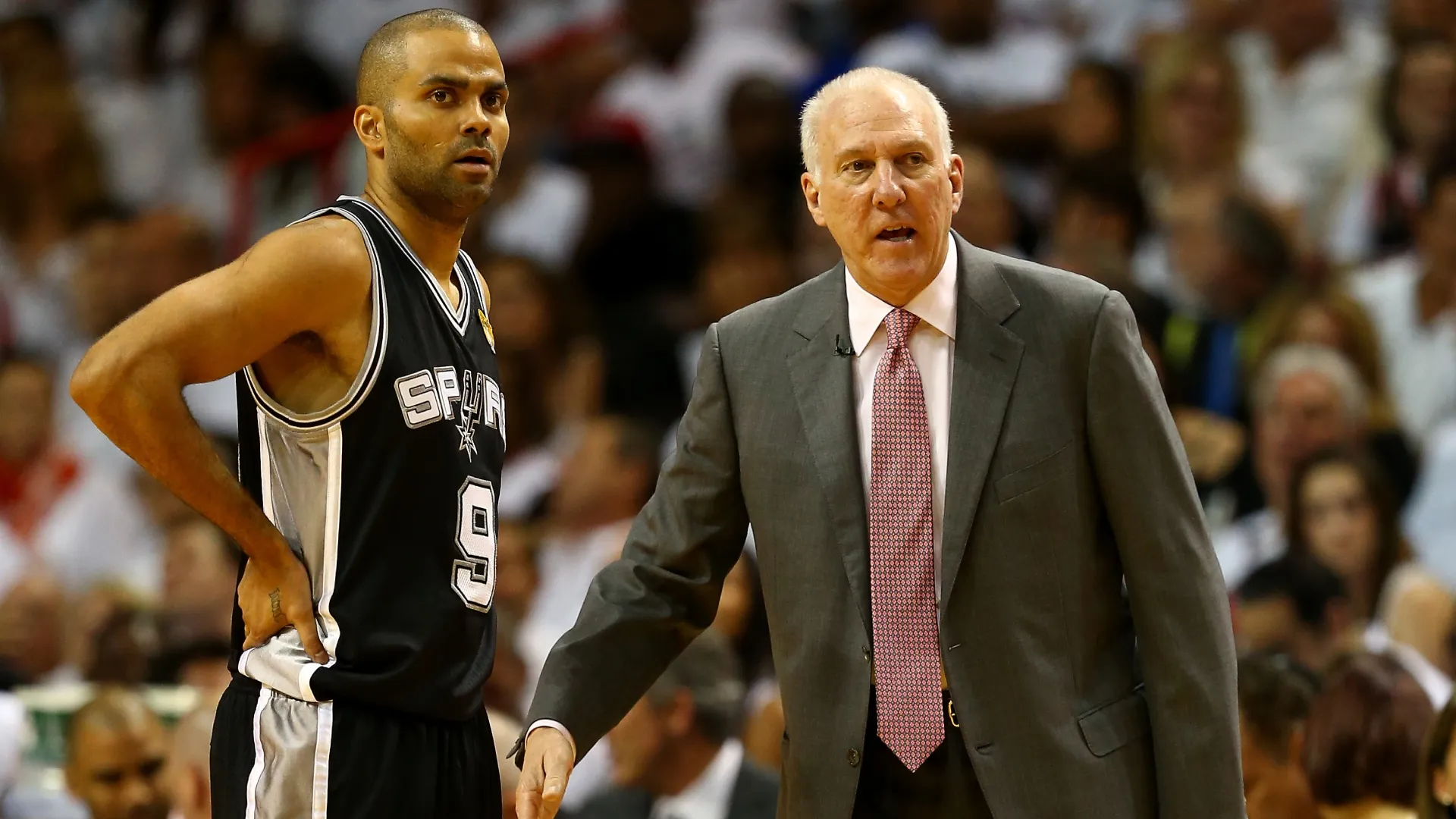 Tony Parker speaks with hTony Parker speaks with head coach Gregg Popovich during Game Three of the 2014 NBA Finals (Source: Andy Lyons/Getty Images)