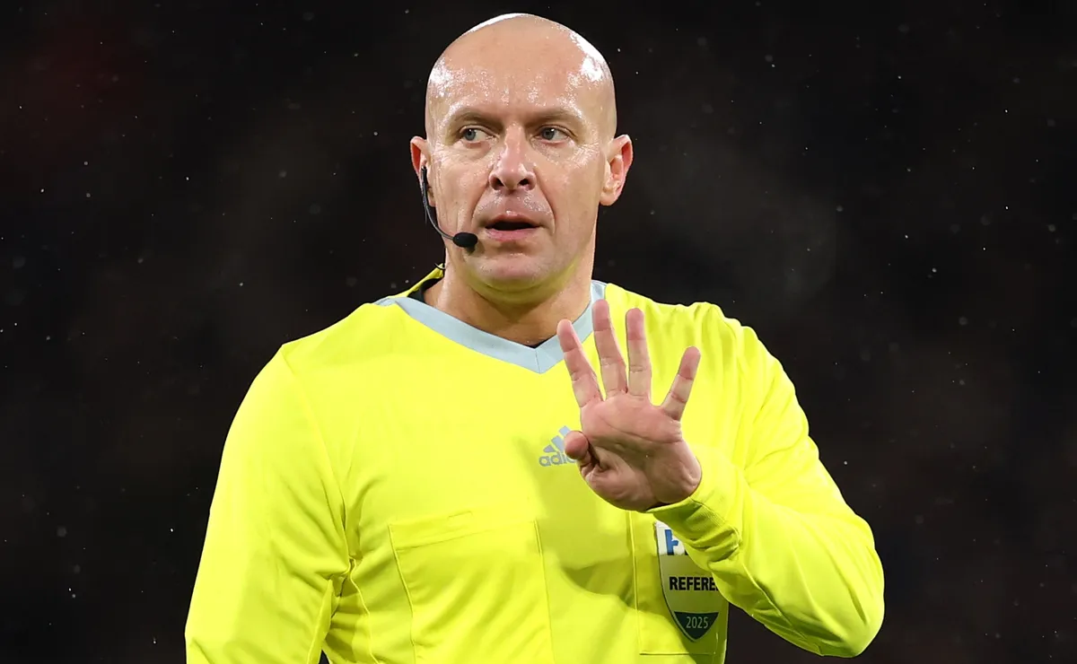 A referee makes a decision during a FIFA World Cup 2026 qualifier match.