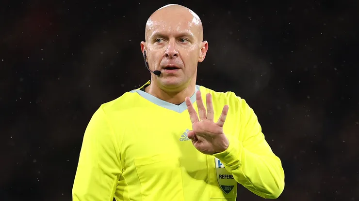 Referee Szymon Marciniak makes a decision during the FIFA World Cup 2026 qualifier match