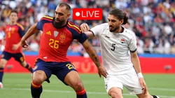 Borja Iglesias of Spain battles for the ball with Akam Hashim of Iraq.