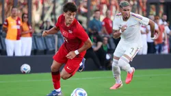 Arda Guler #8 of Turkiye dribbles the ball.