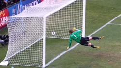 Manuel Neuer of Germany watches the ball bounce over the line.