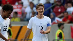 Martin Odegaard of Norway celebrates with teammates.